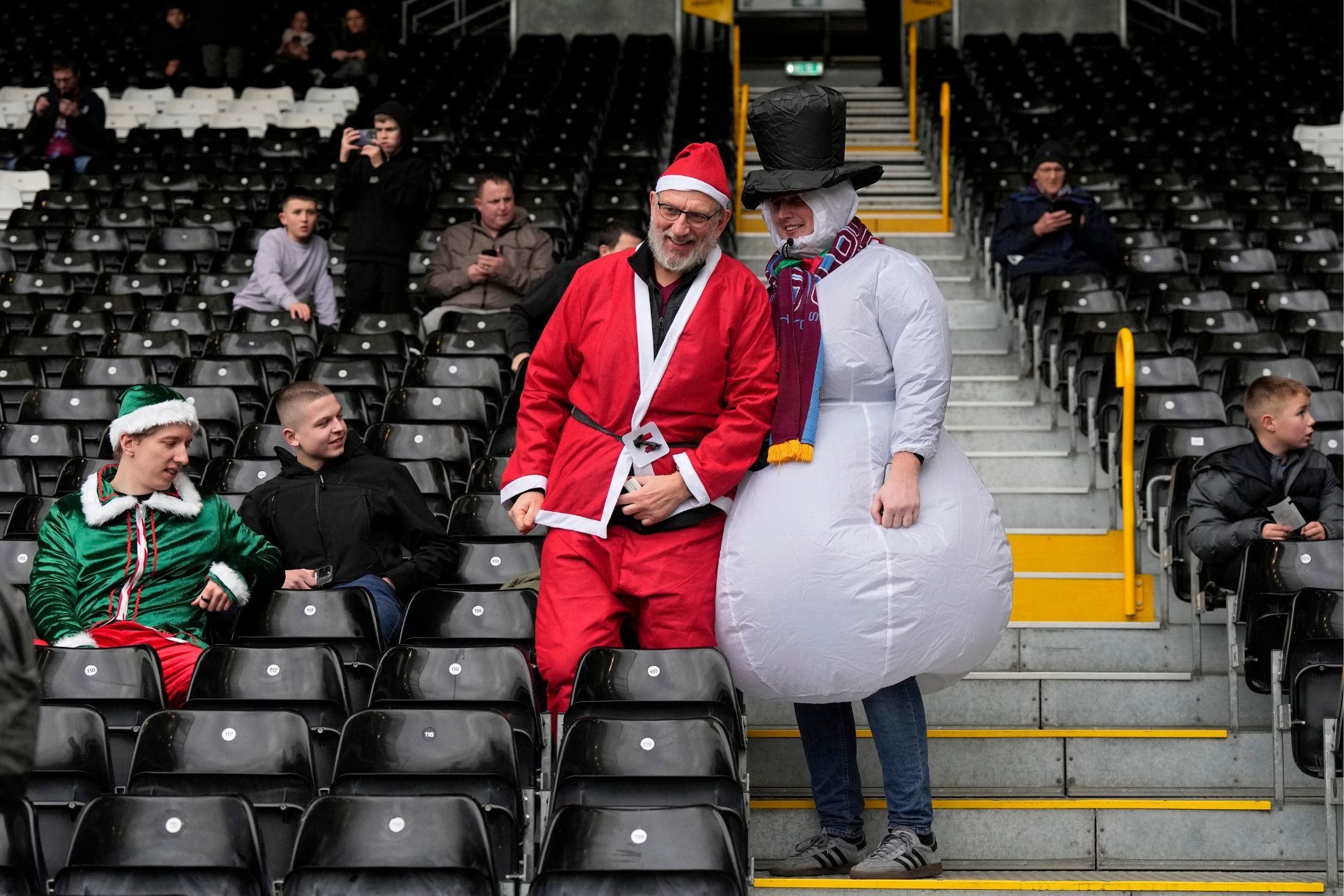 Burnley supporters take their seats on the stands ahead of the English Premier League soccer match